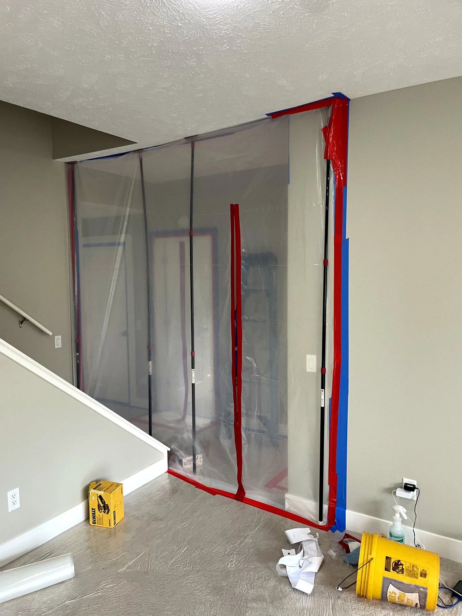 Poly containment barrier protecting unaffected rooms during water damage restoration in Middleville MI