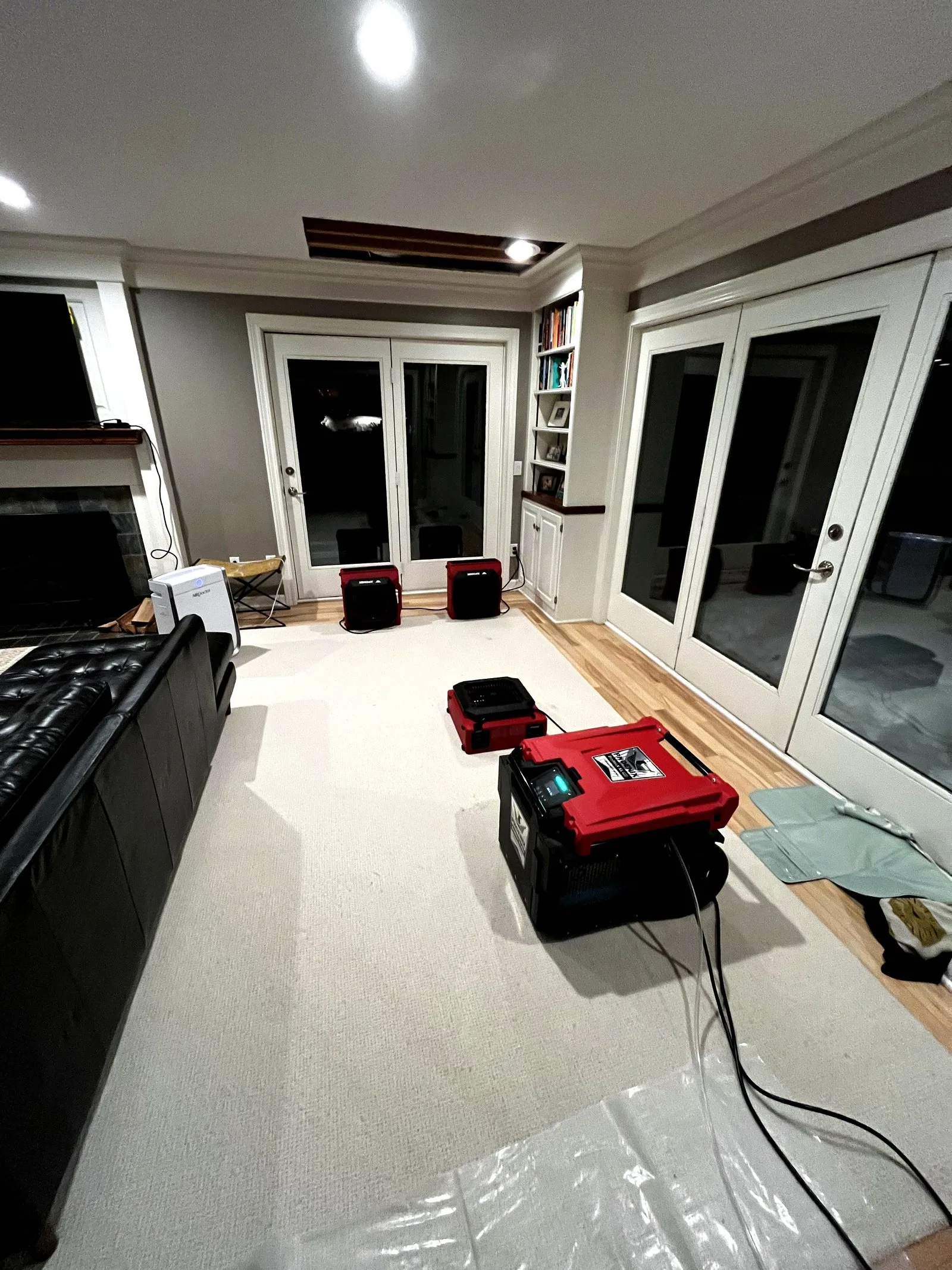 Phoenix air movers and dehumidifiers running in a Grand Rapids living room after water damage